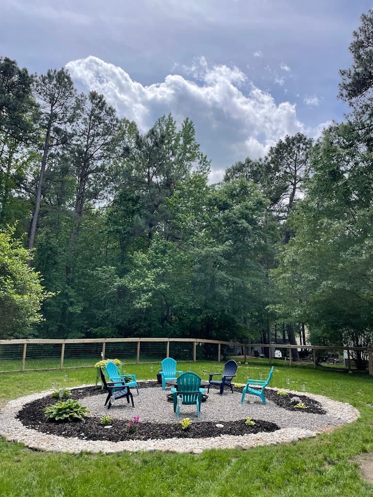 Backyard fire pit patio with gravel and mulch surround installed by Local Boys Lawn and Landscape